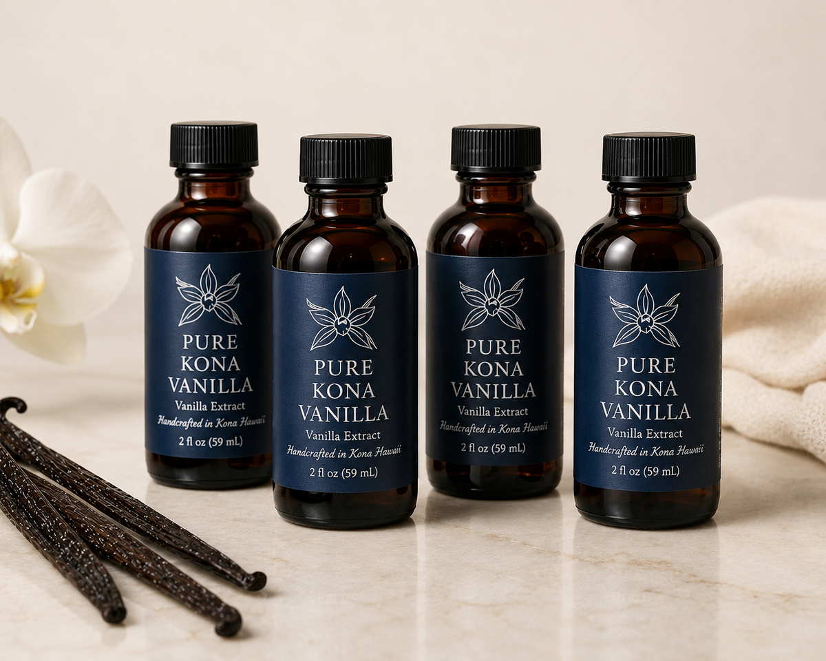 Four Pure Kona Vanilla Extract 2fl oz bottles with branded labels, handcrafted in Kona Hawaii